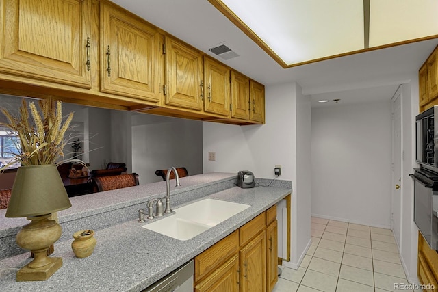 7000 E Quincy Ave Unit 302, Denver, CO 80237 - kitchen with a sink, light tile patterned floors, oven, light countertops, and baseboards
