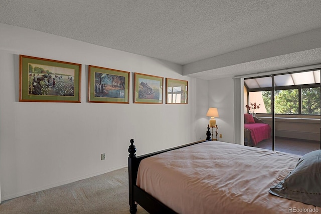7000 E Quincy Ave Unit 302, Denver, CO 80237 - carpeted bedroom with a textured ceiling, baseboards, and access to exterior