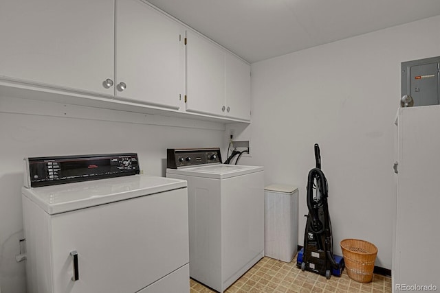 7000 E Quincy Ave Unit 302, Denver, CO 80237 - laundry room with cabinet space, washer and dryer, and electric panel