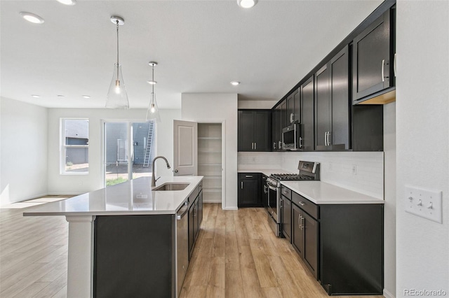 9332 Bahama Ct, Commerce City, CO 80022 - kitchen with a sink, stainless steel appliances, light wood-type flooring, light countertops, and decorative backsplash