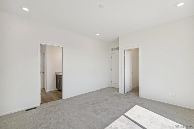 9332 Bahama Ct, Commerce City, CO 80022 - unfurnished bedroom featuring light colored carpet, visible vents, and recessed lighting