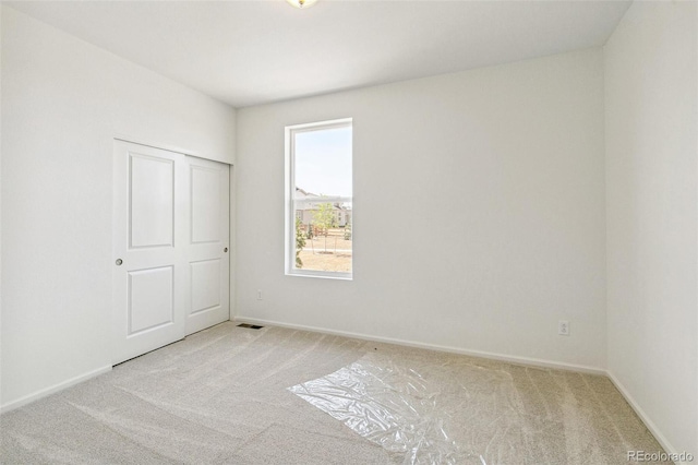 9332 Bahama Ct, Commerce City, CO 80022 - empty room with light colored carpet, baseboards, and visible vents