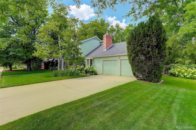 view of front of property with a garage and a front yard