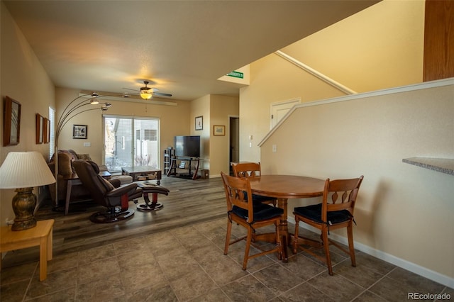 10473 Table Rock Ct Unit E, Poncha Springs, CO 81242 - dining area featuring a ceiling fan, baseboards, and dark tile patterned flooring