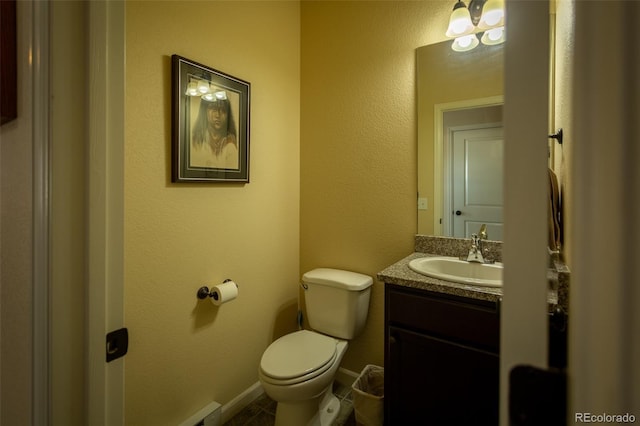 10473 Table Rock Ct Unit E, Poncha Springs, CO 81242 - bathroom featuring vanity, toilet, tile patterned floors, and baseboards