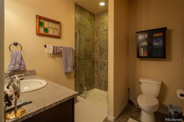 10473 Table Rock Ct Unit E, Poncha Springs, CO 81242 - bathroom with a shower stall, toilet, vanity, tile patterned flooring, and baseboards