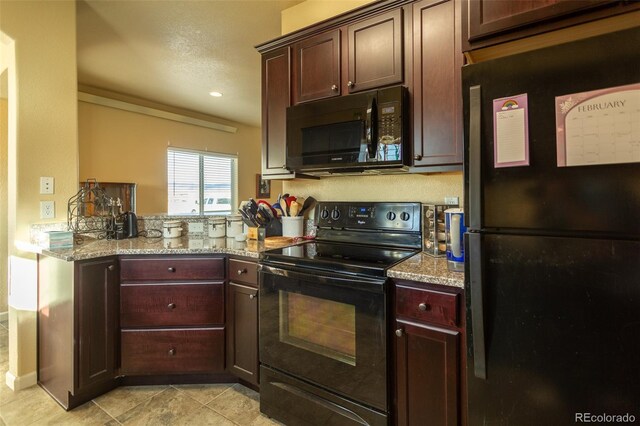 10473 Table Rock Ct Unit E, Poncha Springs, CO 81242 - kitchen featuring black appliances, light tile patterned flooring, and light stone counters