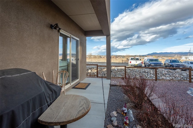 10473 Table Rock Ct Unit E, Poncha Springs, CO 81242 - view of patio featuring a mountain view and a grill