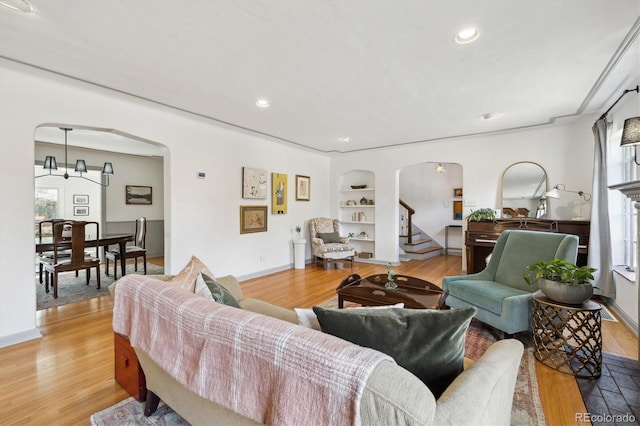629 Bellaire St, Denver, CO 80220 - living room with arched walkways, plenty of natural light, light wood finished floors, and recessed lighting