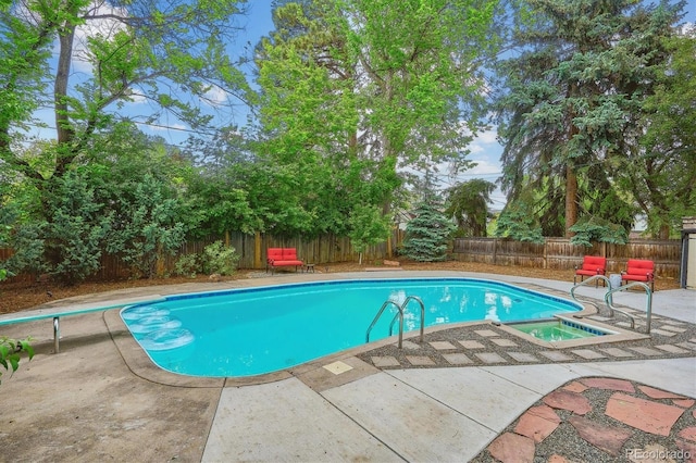 629 Bellaire St, Denver, CO 80220 - view of pool featuring a patio area, a fenced backyard, a diving board, and a pool with connected hot tub