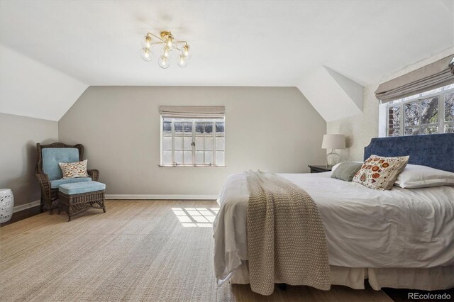 629 Bellaire St, Denver, CO 80220 - bedroom featuring a chandelier, vaulted ceiling, and carpet