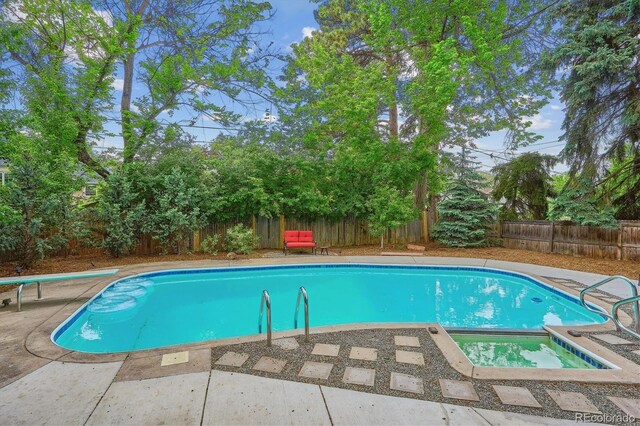 629 Bellaire St, Denver, CO 80220 - view of pool featuring a fenced backyard, an in-ground hot tub, a patio, and a diving board