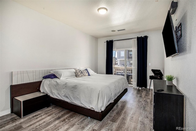 9434 Ashbury Cir Unit 204, Parker, CO 80134 - bedroom with wood finished floors and baseboards