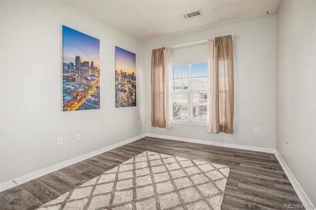 9434 Ashbury Cir Unit 204, Parker, CO 80134 - spare room featuring wood finished floors and baseboards