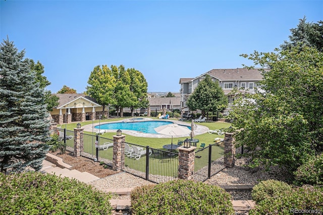 9434 Ashbury Cir Unit 204, Parker, CO 80134 - view of pool featuring a residential view, a gate, a pool with connected hot tub, and a patio area