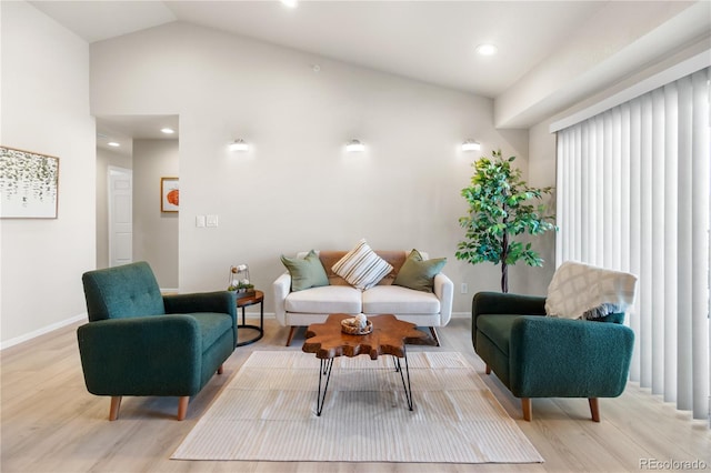 875 E 78th Ave Unit 21, Denver, CO 80229 - living area with light wood-style flooring, baseboards, recessed lighting, and lofted ceiling