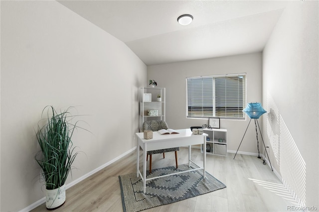 875 E 78th Ave Unit 21, Denver, CO 80229 - office area featuring light wood-type flooring, baseboards, and lofted ceiling