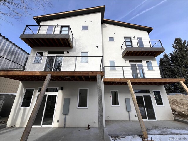 rear view of property featuring a patio area