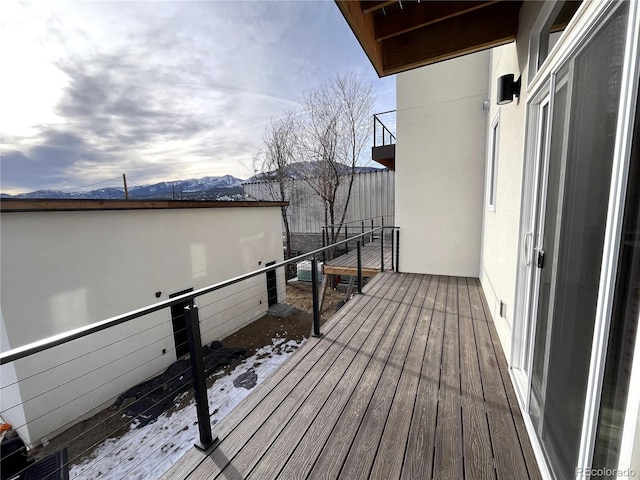 wooden terrace featuring a mountain view