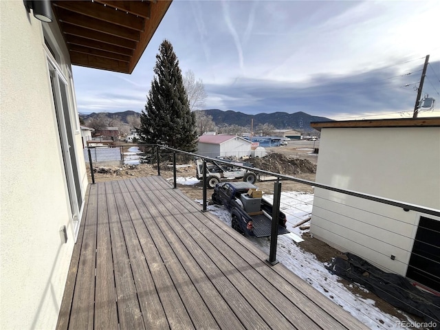 wooden terrace featuring a mountain view