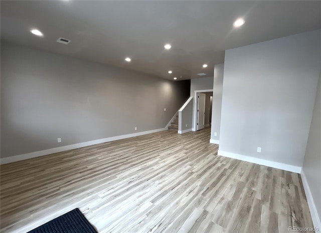 empty room with light hardwood / wood-style flooring