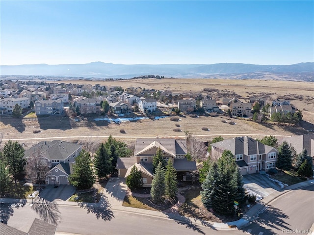 drone / aerial view with a residential view and a mountain view