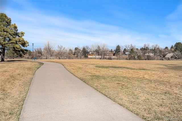 view of home's community with a lawn