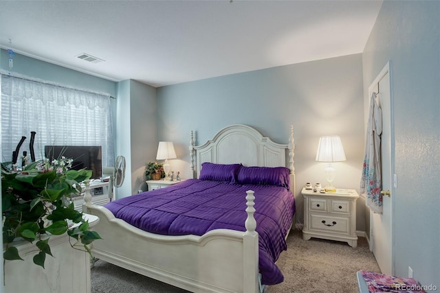 bedroom with visible vents and carpet flooring