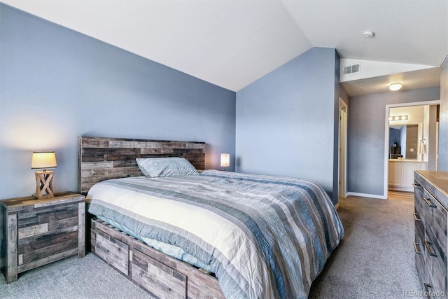 bedroom featuring vaulted ceiling and carpet