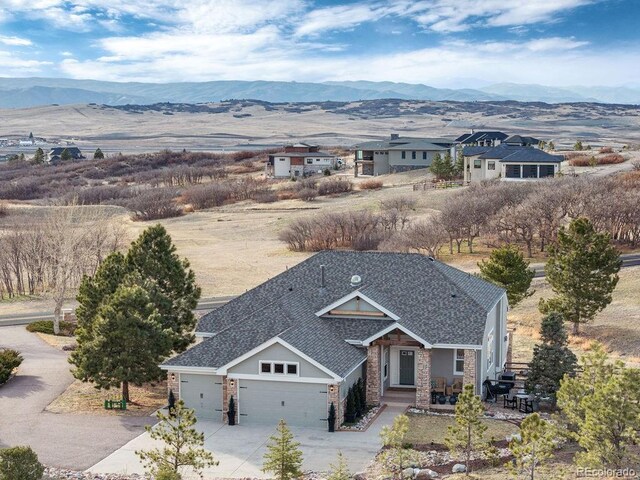 drone / aerial view featuring a mountain view