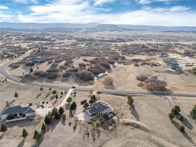 aerial view with a mountain view and a rural view
