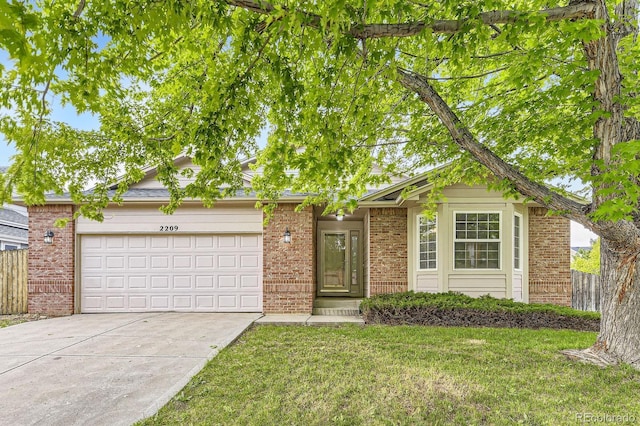 2209 S Flanders St, Aurora, CO 80013 - view of front of house with concrete driveway, brick siding, and an attached garage