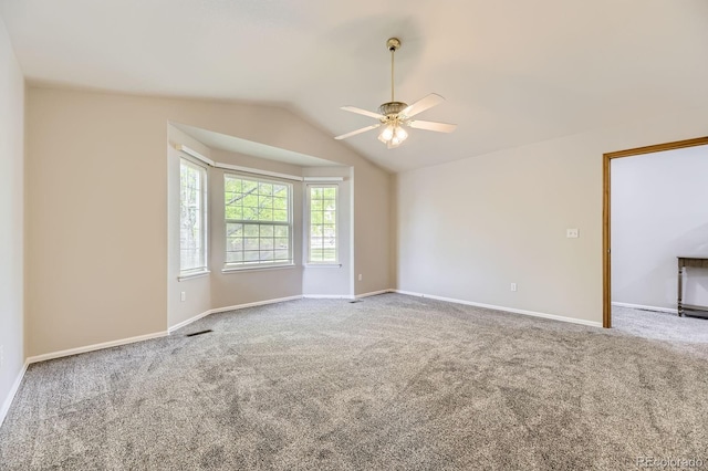 2209 S Flanders St, Aurora, CO 80013 - carpeted empty room featuring a ceiling fan, vaulted ceiling, and baseboards