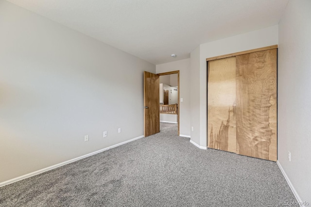 2209 S Flanders St, Aurora, CO 80013 - unfurnished bedroom with carpet, baseboards, and a closet