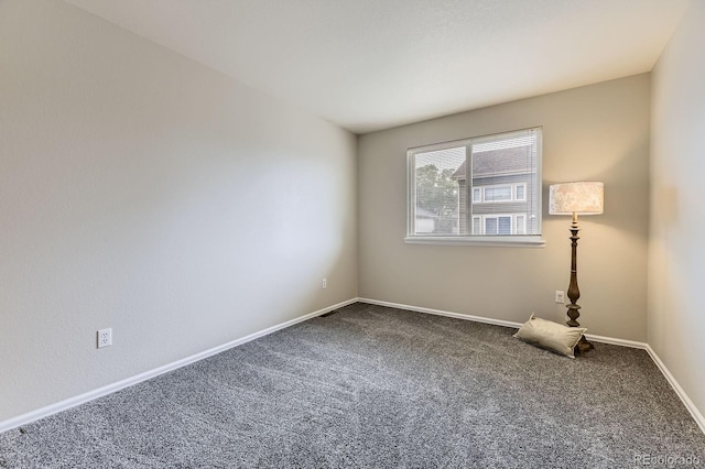 2209 S Flanders St, Aurora, CO 80013 - carpeted spare room with baseboards