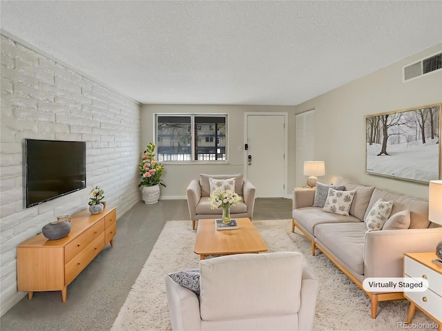 living room with a textured ceiling