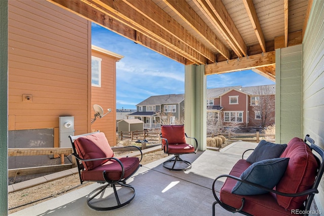 view of patio / terrace with a balcony and a residential view