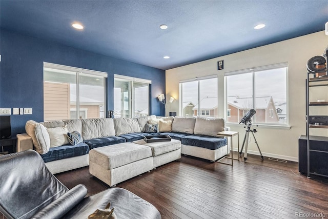 living area with recessed lighting, wood-type flooring, and baseboards