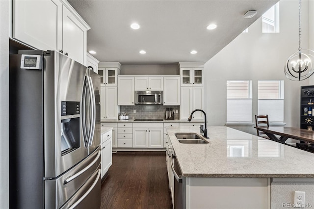 kitchen with white cabinetry, appliances with stainless steel finishes, and a sink