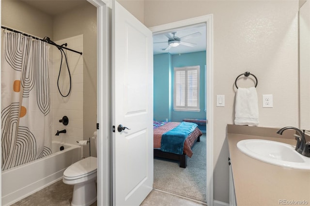 ensuite bathroom with shower / tub combo with curtain, toilet, ensuite bathroom, vanity, and tile patterned flooring