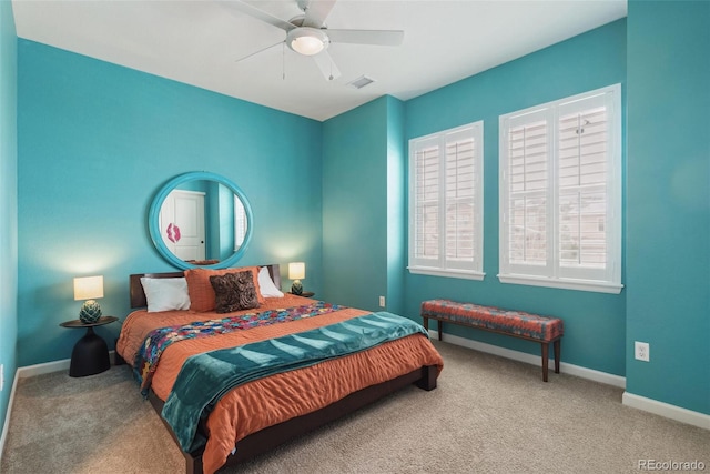 bedroom featuring a ceiling fan, carpet flooring, visible vents, and baseboards