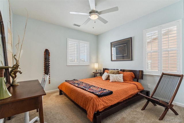 bedroom featuring carpet, visible vents, ceiling fan, and baseboards