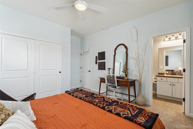 bedroom featuring ensuite bath, baseboards, a closet, and light colored carpet