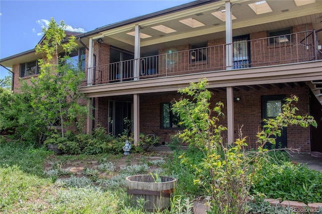 962 S Beech St, Lakewood, CO 80228 - back of house with brick siding and a balcony