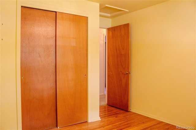 962 S Beech St, Lakewood, CO 80228 - unfurnished bedroom with a closet and light wood-style flooring