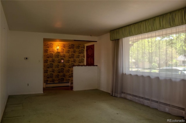 962 S Beech St, Lakewood, CO 80228 - carpeted spare room featuring a baseboard radiator and baseboards