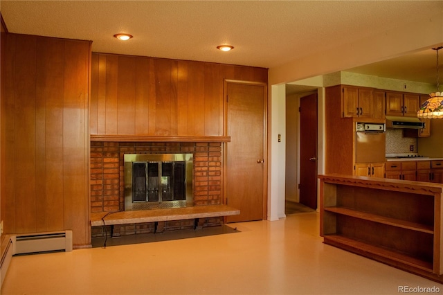 962 S Beech St, Lakewood, CO 80228 - living room with a brick fireplace, wooden walls, and a baseboard heating unit