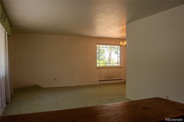 962 S Beech St, Lakewood, CO 80228 - empty room with a baseboard radiator, a chandelier, and carpet flooring