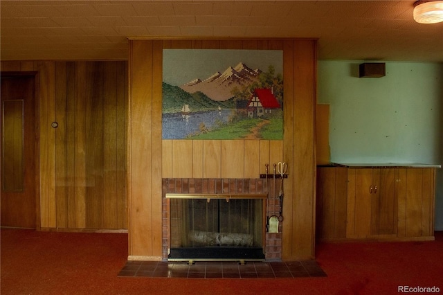 962 S Beech St, Lakewood, CO 80228 - detailed view of wooden walls, a fireplace, and carpet
