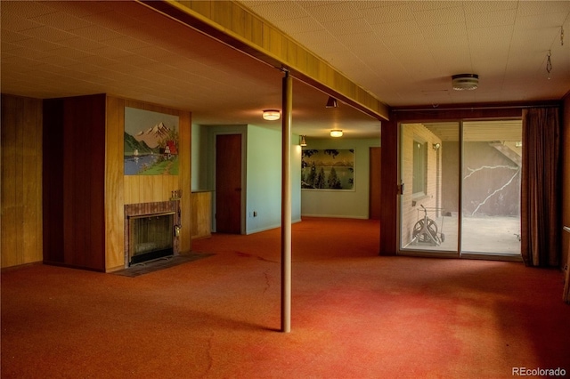 962 S Beech St, Lakewood, CO 80228 - interior space featuring wooden walls, carpet flooring, and a fireplace with flush hearth
